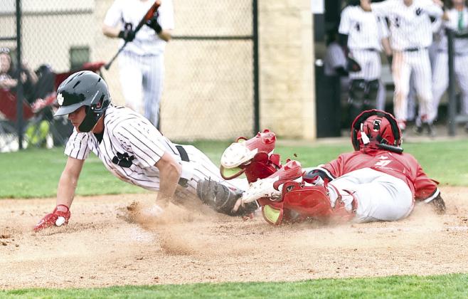 North Rock Creek's Jaxson Loftis slides past the catcher for the score. Photo courtesy of Gowin Photography