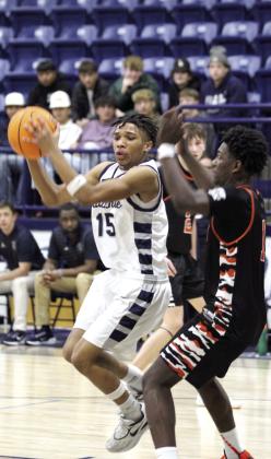 Shawnee sophomore Rah’Mel Slaughter gets ready to make a bucket in the Jan. 7 home game with Booker T. Washington. The Wolves lost, 4866, and the Lady Wolves also fell, 40-43. File photo