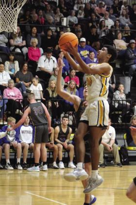 Tecumseh’s Jace Edwards goes up for a basket in the second quarter of the homecoming game against Bethel on Feb. 3. The Savages lost, 61-70.