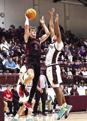 North Rock Creek's Kohen Warden goes up for the shot in the ECOS Invitational championship game against Ada on Jan 10. The boys brought home the gold with a 48-46 win over Ada. Photo Provided by Gowin Photography