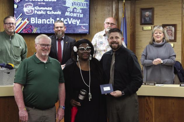 Shawnee Bus Monitor Blanch McVey, center, was chosen as the Shawnee Star of the Month during the Jan. 8 Shawnee Board of Education meeting. Also shown are Transportation Director John Wiles, left, and Superintendent Dr. Aaron Espolt. Behind them are members of the board, Russ Oliver, President Clif Harden, Keith Sandlin and April Stobbe. Countywide &amp; Sun/Natasha Dunagan