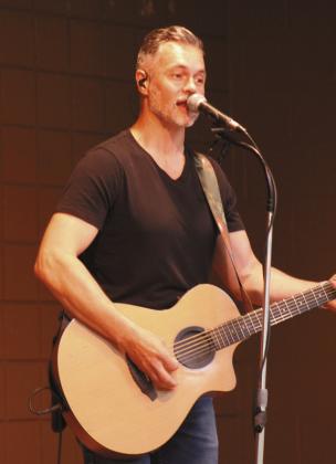 Brendan Parker, on guitar and vocals, leads the children's band 'Spaghetti Eddie!' at Tecumseh Public Library on July 24.