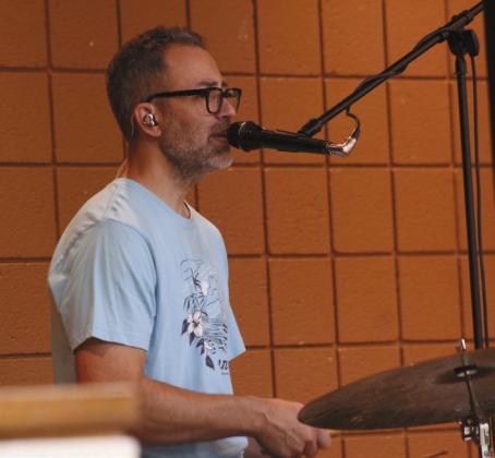 Erick Alexander, on drums and backup vocals, performs with the children's band 'Spaghetti Eddie!' at Tecumseh Public Library on July 24. Photos by Natasha Dunagan, Countywide &amp;amp; Sun