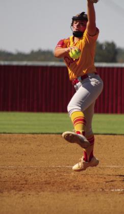 Dale sophomore Kinsley HIll becomes airborne as she winds up her pitch in the fifth inning of the game against Wyandotte.