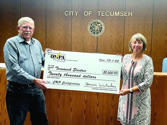 Tecumseh Mayor Eddy Parker accepts a $20,000 check from Oklahoma Municipal Power Authority Representative Palma Lowewith. Countywide &amp;amp; Sun/Ryan Ackerman
