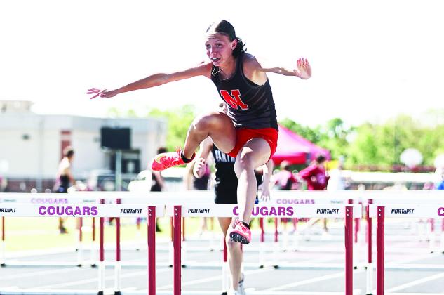 North Rock Creek's Felicia Hankins finished fifth in the 100m hurdles. The Lady Cougars finished with a team score of 171 points. Photo courtesy of Gowin Photography