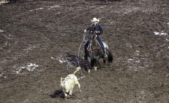 Competing in mud and rain, Rowdy John Pino, of McLoud, comes up short in the calf roping event during the International Finals Youth Rodeo on July 7. Countywide &amp; Sun/Natasha Dunagan
