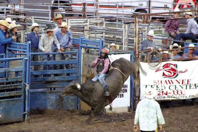 Ryker Butler, of McLoud, hangs on for the ride during the International Finals Youth Rodeo on July 7. Butler was the bull riding champion at last year’s IFYR. Countywide &amp; Sun/Natasha Dunagan