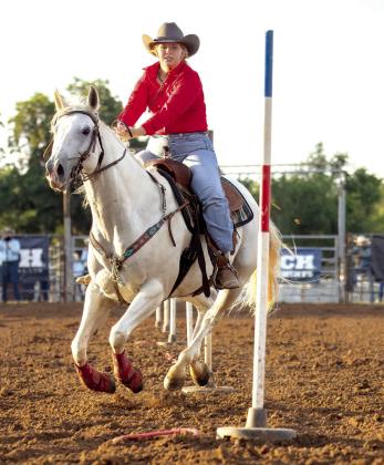 Josey Milburn, of Asher, competes in the pole bending of the 32nd Annual International Finals Youth Rodeo on July 8 at the Heart of Oklahoma Expo Center. Photo courtesy of Richelle Treece.