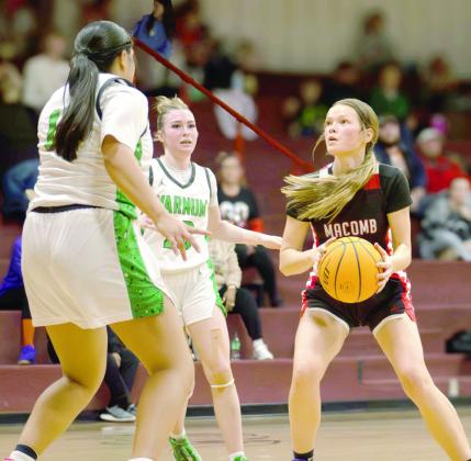 Surrounded by Varnum defenders, Macomb's Addy Beauchamp looks for an opening.