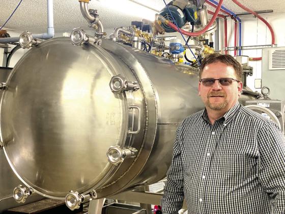 Mike McElyea, Co-Owner, Funeral Director, and Memorial Care Specialist stands next to the newly installed Aquamation machine. He said you can have a normal conversation while this equipment is running. Countywide &amp;amp; Sun/Suzie Campbell