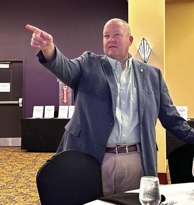 Rep. Dell Kerbs scans the crowd looking for bidders at the Honey Do Auction. Suzie Campbell, Countywide &amp; Sun