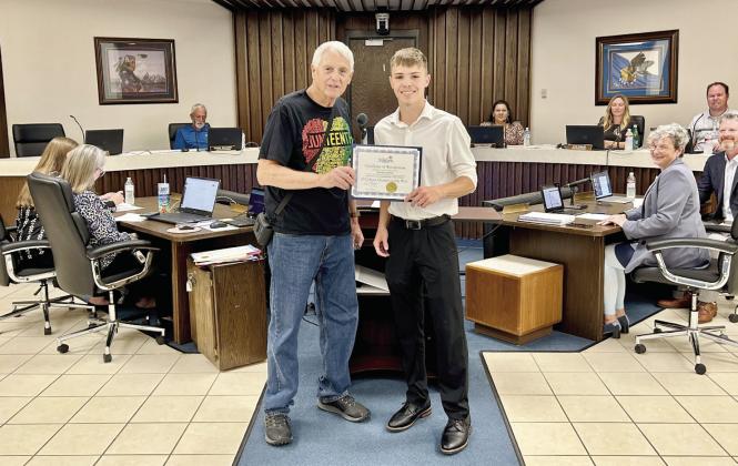 Mayor Ed Bolt recognizes Shawnee High School Pole Vaulting State Champion Keifer Landes during the June 17, 2024 meeting. Countywide &amp; Sun/Suzie Campbell