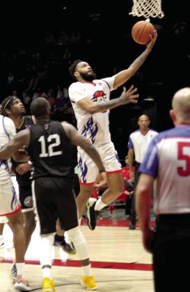Potawatomi Fire Guard Darin Johnson makes a layup in the second quarter of the home game on April 29.