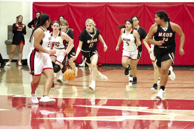 Maud freshman Aubri Kueneman moves the ball down the court during the fourth quarter of the game at Macomb, Nov. 28. The Maud Lady Tigers won, 51-33. Countywide &amp;amp; Sun/Natasha Dunagan
