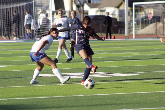 Shawnee’s Vaschti Tiger-Harjo kicks the ball away from a Victory Christian player during the home game on April 2. The Lady Wolves lost, 0-6. Countywide &amp; Sun/Natasha Dunagan