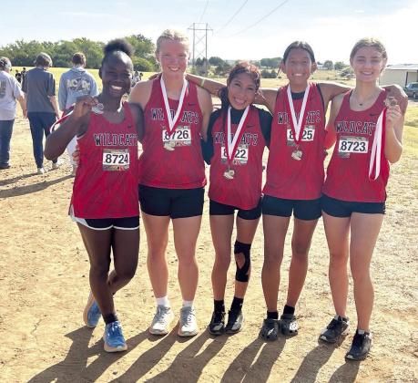 Pictured from left are Zeaonna McGregor, Peighton Worley, Karmalea Howell, Aha Roubidoux, and Xalina McCarroll. For the second week in a row, the EHS Lady Wildcats claimed Runner Up in The Heartland Championship cross country race held at North Rock Creek, and all five team members medaled. Freshman Peighton Worley took seventh, sophomores Karmalea Howell and Aha Roubidoux placed eighth and ninth, respectively. Freshman Zeaonna McGregor placed 11th and junior Xalina McCarroll placed 15th.