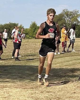Earlsboro's Cross Country teams, coached by Gordon Elmore, competed in The Heartland Championship race held at North Rock Creek on Sept. 14. Both the boys and girls teams claimed Runner Up in the Small High School Division. Four of the seven members of the Wildcats Cross Country team medaled. Junior Brayden Rawls placed second, Freshmen Dawson Roach, Eco Roubidoux, and Taziah Soap placed seventh, 10th, and 11th, respectively. Pictured above, Brayden Rawls rounds the curve as he heads to the finish line.