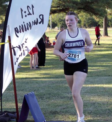 Shawnee freshman Karlee Lynn runs across the finish line at Tecumseh High School's Cross Country Meet on Sept. 10. Countywide &amp; Sun/Natasha Dunagan