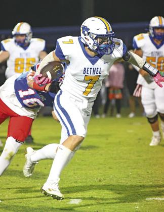 Bethel’s Luke Quinter (7) gets past Chandler’s Coniah Ritchie (16).