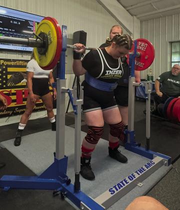 Dale sixth-grader Colleen Williams competes in the squat at Crain's Muscle World, Ltd., in Shawnee, recently. Williams has broken several records in her age and weight class. Photo provided.