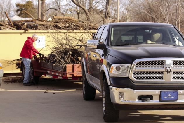 Shawnee Mayor, Ed Bolt loads limbs onto the trailer during the cleanup in Dunbar Heights on Martin Luther King Jr. Day. Photo provided
