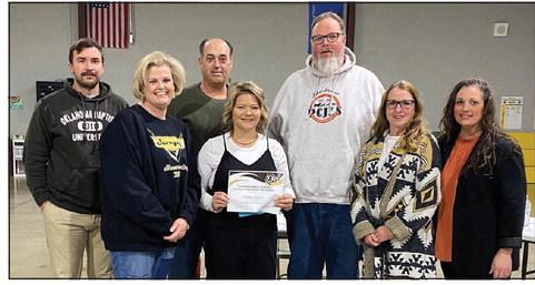 Tecumseh Alumni, Brittany Burgess, was recognized as Support Employee of the month at this month’s Tecumseh School Board meeting. Pictured from left to right: Board Member, Dylan Hays; Barnard Principal, Karla Buchanan; Board Member, Todd Kennedy; Barnard ParaProfessional, Brittany Burgess; Board Member, Tim Underwood; Board Member, Iva Bingham and Board Member, Nichole Sanchez. Countywide &amp;amp; Sun/Julie Talton