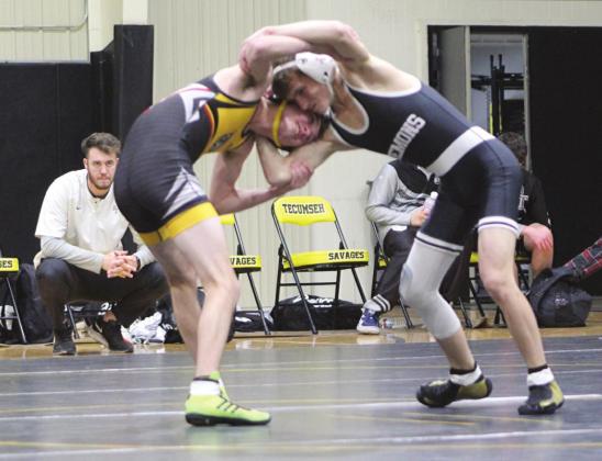 Tecumseh’s Cole Loudermilk, left, in the 106-pound class, faces off with his Perkins-Tryon opponent during the dual meet.