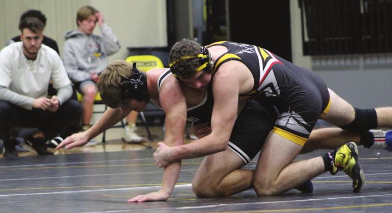 Tecumseh’s J.D. Sigman, in the 145-pound class, tries to flip his Perkins-Tryon opponent on Jan. 4. Sigman lost by decision.