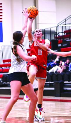 North Rock Creek’s Aubree Shivelhood puts a shot up over the Stratford player. Photo couresy of Gowin Photography