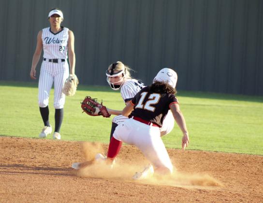 Dale's Catelyn Edwards slides into second as Shawnee's Jalee Reeves tries to block and tag. Natasha Dunagan, Countywide &amp; Sun