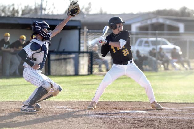 Tecumseh's Wyatt Dodgion takes his turn at bat as Shawnee catcher Cruz Winsett reaches to catch the ball. Natasha Dunagan, Countywide &amp; Sun