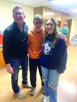 Jerry, Jaxon and Jacey Kuhn (pictured from left) began preparing the Thanksgiving dressing 19 years ago, when the Tecumseh Family Thanksgiving Dinner was started by Suzanne and Randy Gilbert. They have continued this tradition every year since. Photo provided
