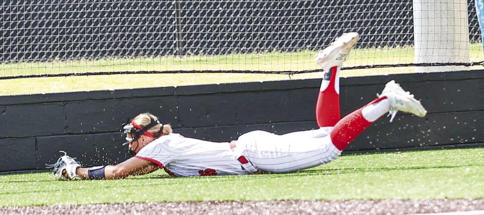 Senior Aspyn Harder makes a diving catch for the out on Aug. 11 when NRC softball took on Cleveland in a district game, winning 16-6, on Aug. 11. Photos courtesy of Gowin Photography