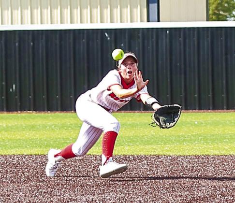 Senior Izzy O'Daniel stretches for the out.
