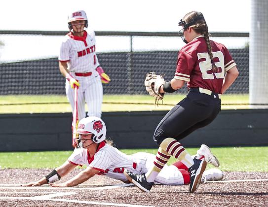 Senior Jaden Clifton slides safe at home on a wild pitch.