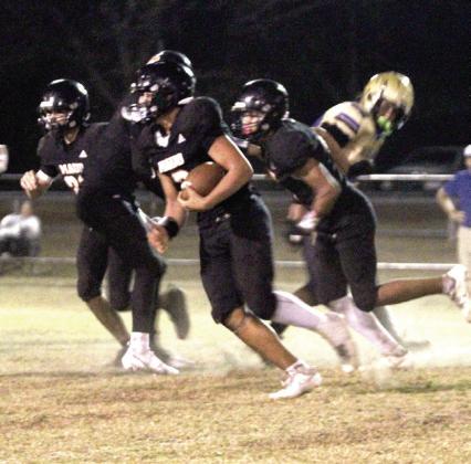 Maud freshman Jonathan Lamas steals the ball and makes it to the Bluejacket's 32-yard line during the Class C First Round Football Playoffs home game on Nov. 14. Lamas also made a touchdown before this play. The Tigers won 46-28 and will now play in the quarterfinals at Timberlake on Nov. 21 at 7 pm, according to www.ossaarankings.com. Natasha Dunagan, Countywide &amp;amp; Sun