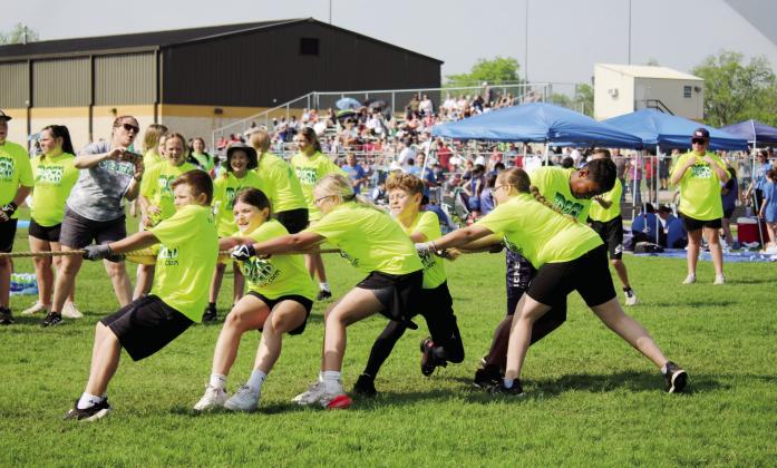 South Rock Creek School fourth-grade students use upper and lower body strength in the tug o' war during the Kiwanis Club's Little Olympics on March 12. The event was held at the Tecumseh High School track this year, due to tornado damage at Shawnee High School's Jim Thorpe Stadium. Assistant Scorekeeper Erika Jones said there has only been one other time in Little Olympic's 90 years that it was held at a different location, and that was at OBU. Countywide &amp; Sun/Natasha Dunagan