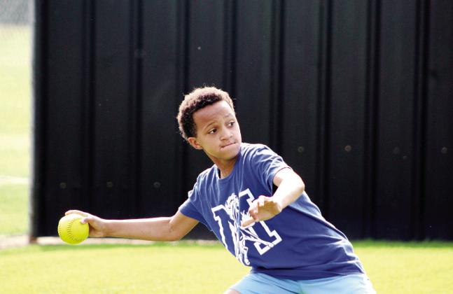 Sequoyah Elementary fourth-grader Zayveon Miller focuses on his goal before letting the softball fly during Little Olympics at the Tecumseh High School track on March 12. Ten Shawnee area schools' fourth- through sixth-graders participated in the event, which was moved due to tornado damage at Shawnee High School. Countywide &amp; Sun/Natasha Dunagan