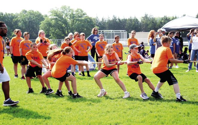 Fourth-grade students from Grove School pull with all their strength in the tug o' war during the Kiwanis Club's Little Olympics on March 12. The event was held at the Tecumseh High School track this year, due to tornado damage at Shawnee High School's Jim Thorpe Stadium. Countywide &amp; Sun/Natasha Dunagan