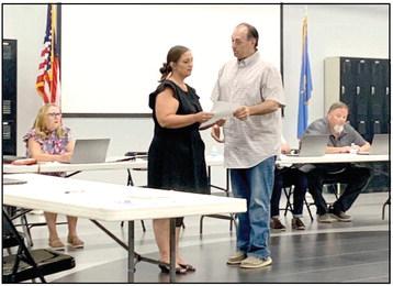 Tecumseh Public Schools Board President Todd Kennedy swears in newly appointed board member Nicole Sanchez. Sanchez will fill Seat 2. Countywide &amp;amp; Sun/Ryan Ackerman