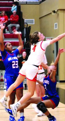 Dale’s Ava Bell is fouled as she goes to the basket against Millwood on Dec. 9 in the Dale Boomarang Classic.