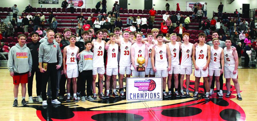 The Dale Pirates and their coaches pose after winning the boys bracket of the Dale Boomarang Classic on Dec. 10. Playing at Dale, Dec. 8-10, the Pirates won all three of their games: Santa Fe South, 75-42, Oklahoma Christian Academy, 77-53, and Oklahoma Christian School, 60-42.