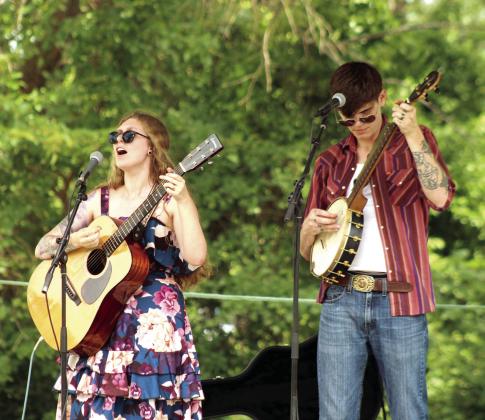 Folk duo Rachel and Griffin, out of OKC, perform at the 131st Annual McLoud Blackberry Festival on June 20. The McKedy's and Chris Kizzia played on June 19, and the Jake Adams Band also took the stage on Saturday at the McLoud Veterans Memorial Park.