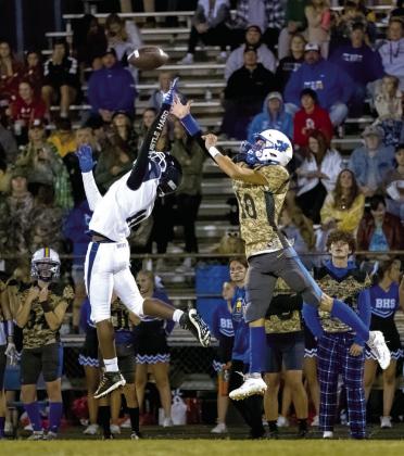 Bethel junior Reagan Curry (#10) and a Star Spencer player try to catch a pass during the Military Appreciation Night home game on Oct. 13. The Bethel Wildcats won 40-38. Photo provided by Richelle Treece.