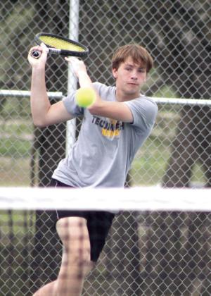 Tecumseh’s Aaron Sack sends the ball flying back while playing on the #2 Doubles team with Brodey Bone during the Tecumseh Tennis Tournament on April 4.