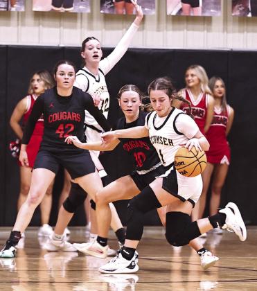 NRC’s Peyton Lilley puts pressure on Tecumseh’s Cadence Leba.