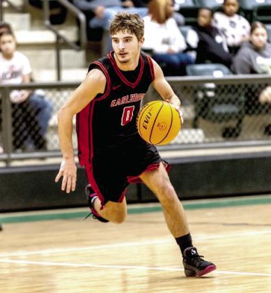 Earlsboro Senior Brayden Rawls takes the ball down court. Photos provided by Amanda Elmore.