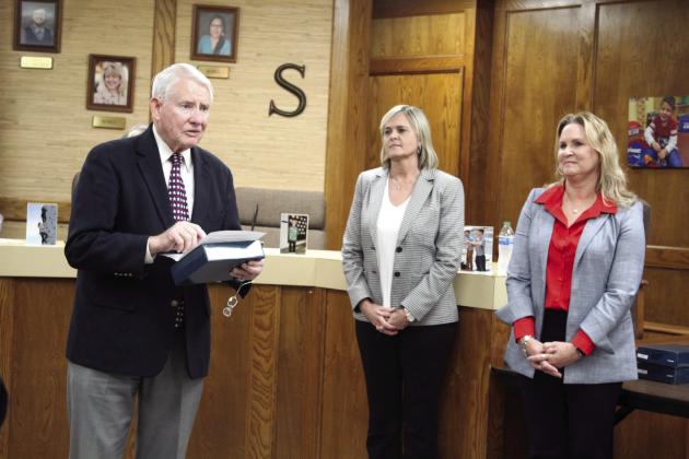 Retiring Shawnee Board of Education Member Larry Walker reads a speech after more than 20 years on the board, as retiring Superintendent Dr. April Grace and Assistant Superintendent of Personnel Dr. Teresa Wilkerson listen during the regular meeting on May 1. Countywide &amp;amp; Sun/Natasha Dunagan