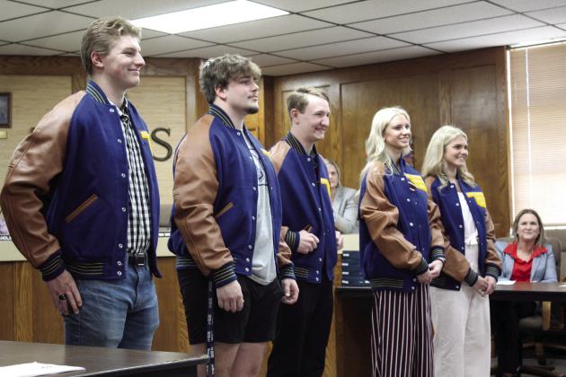 Shawnee seniors who received their All-State jackets in swimming or wrestling were recognized during the Shawnee Board of Education regular meeting on May 1. Shown, from left, are Thurman Lee, Logan Cash, Ethan Oller, Natalie Selman and Piper McNeil.